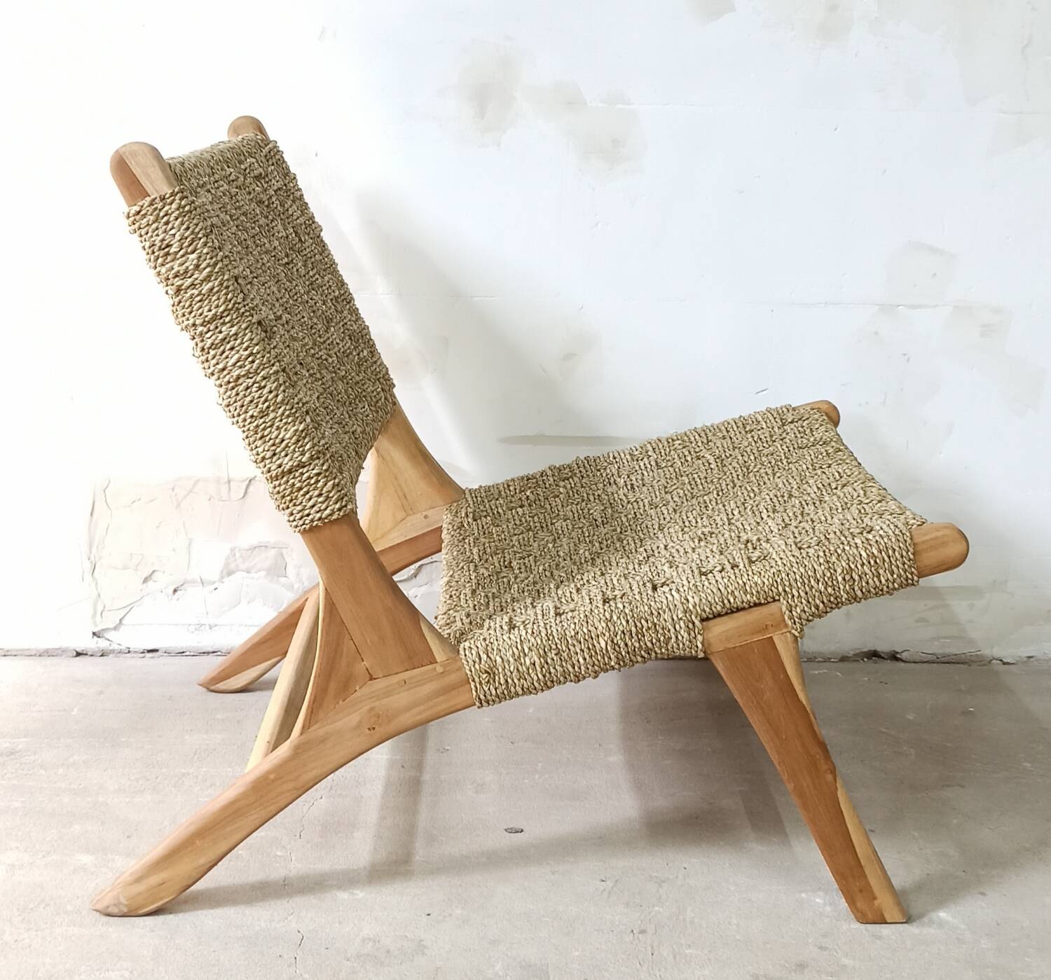 Pair of low armchairs in wood and woven rattan