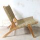 Pair of low armchairs in wood and woven rattan