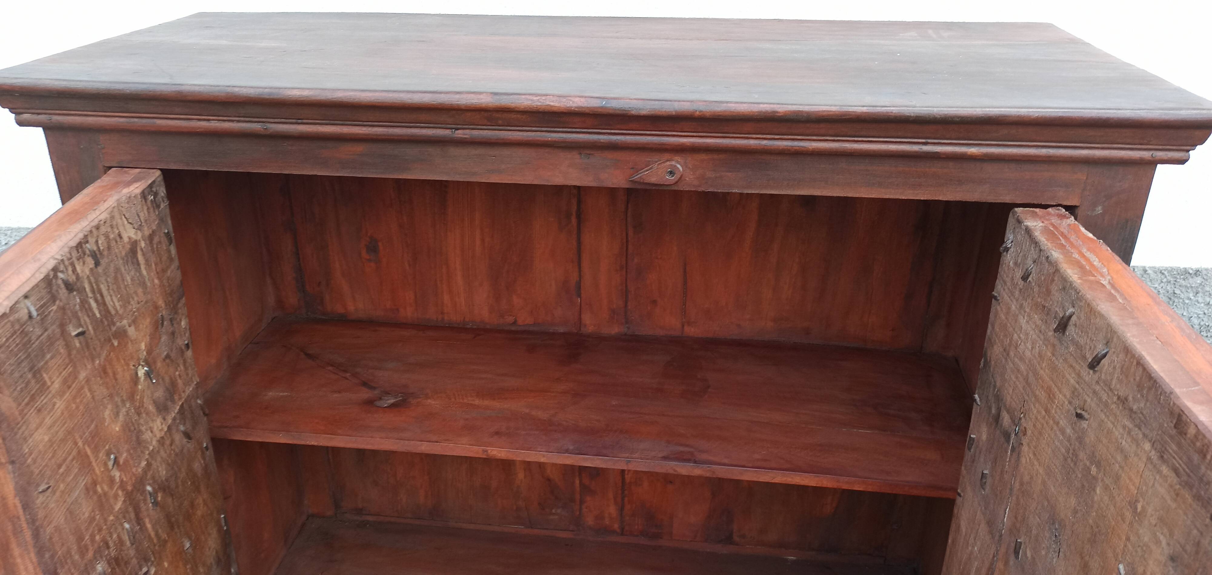 Small old wooden sideboard with two doors