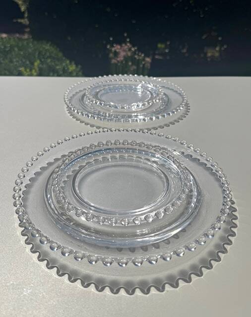 Head to head of crystal plates, Andlau model, signed Lalique