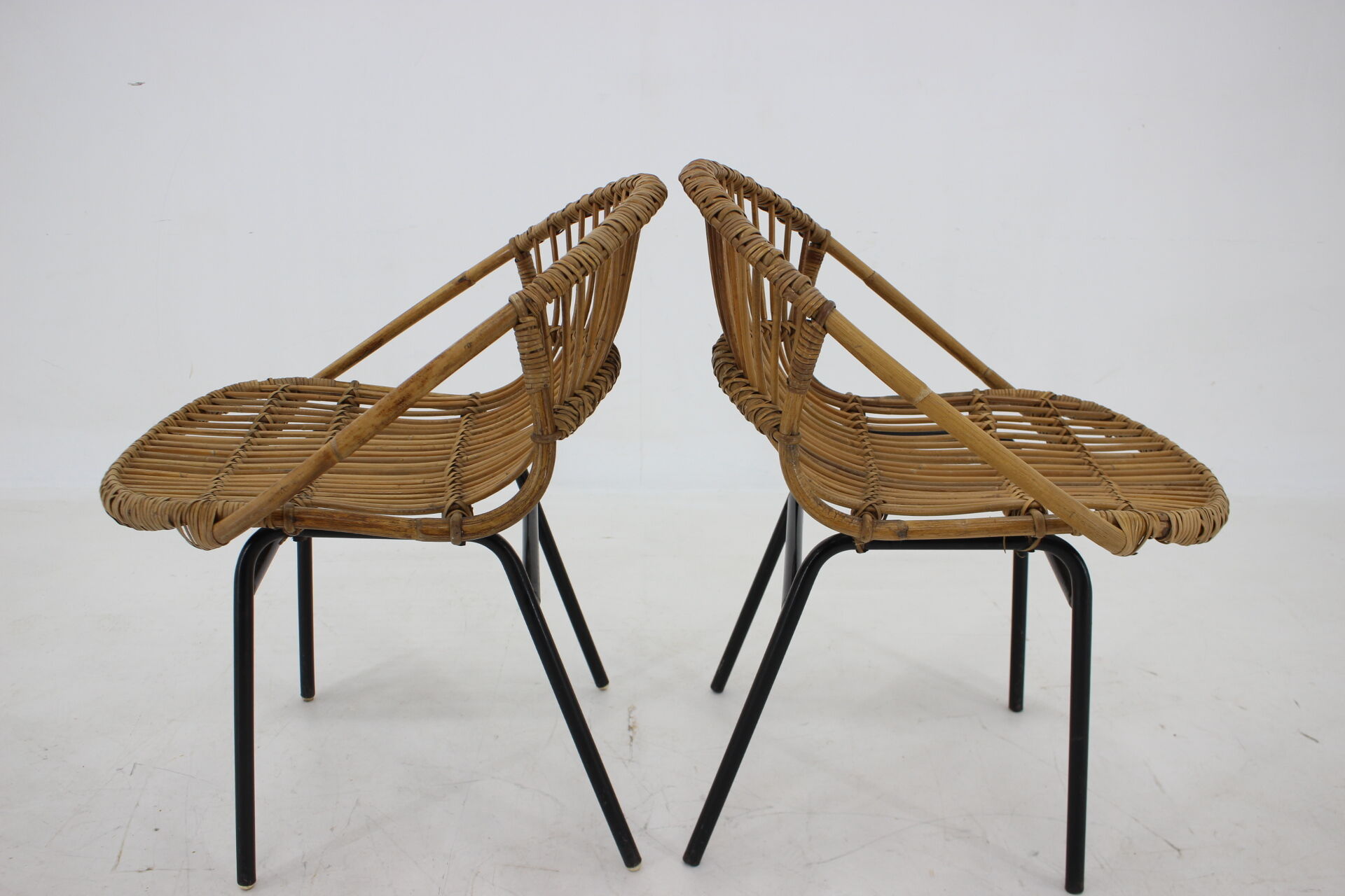 1970s pair of Alan Fuchs rattan and iron lounge chairs, Czechoslovakia