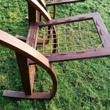 A pair of vintage rope and wood armchairs
