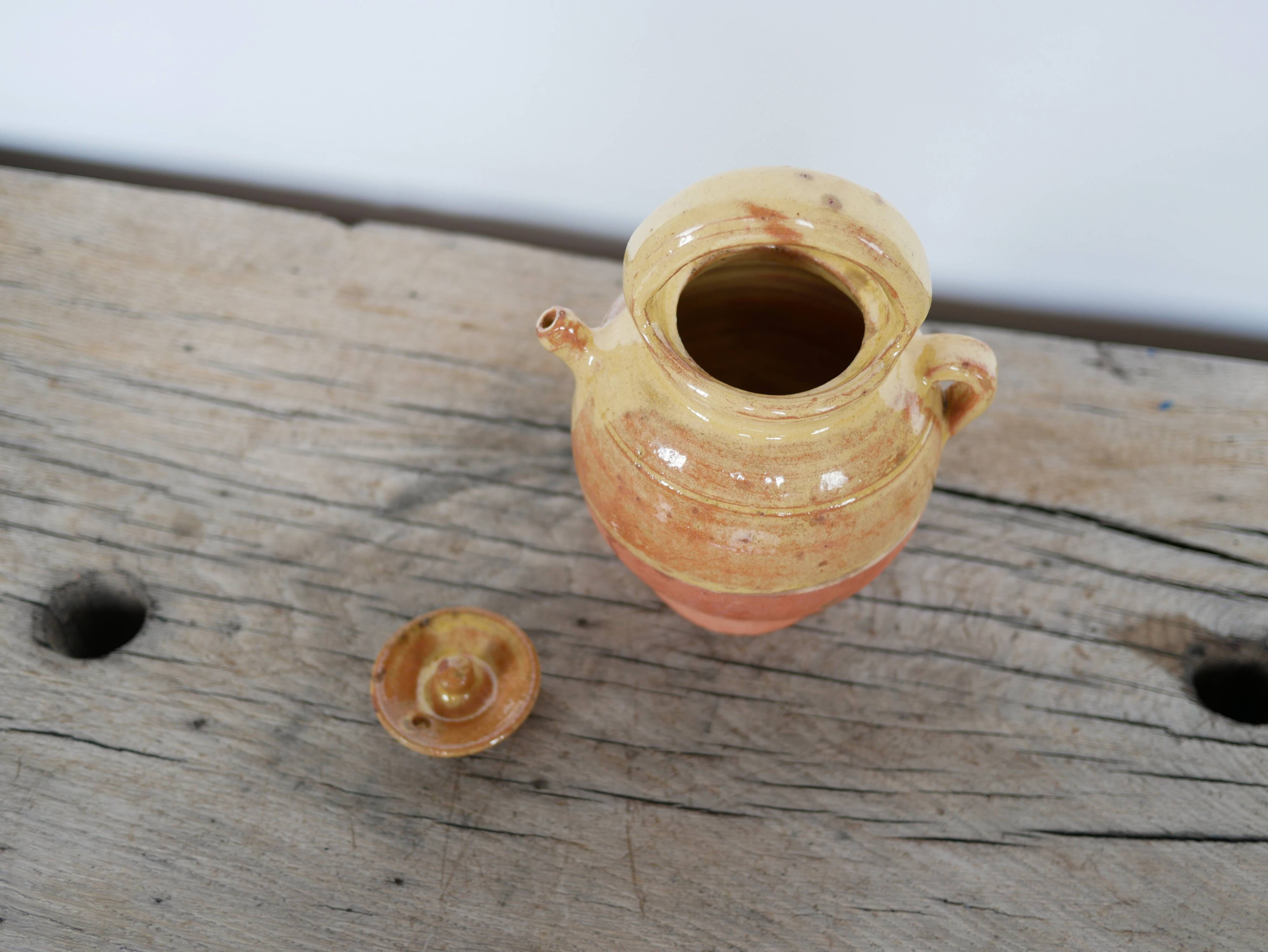 Old gargoulette pot in glazed terracotta