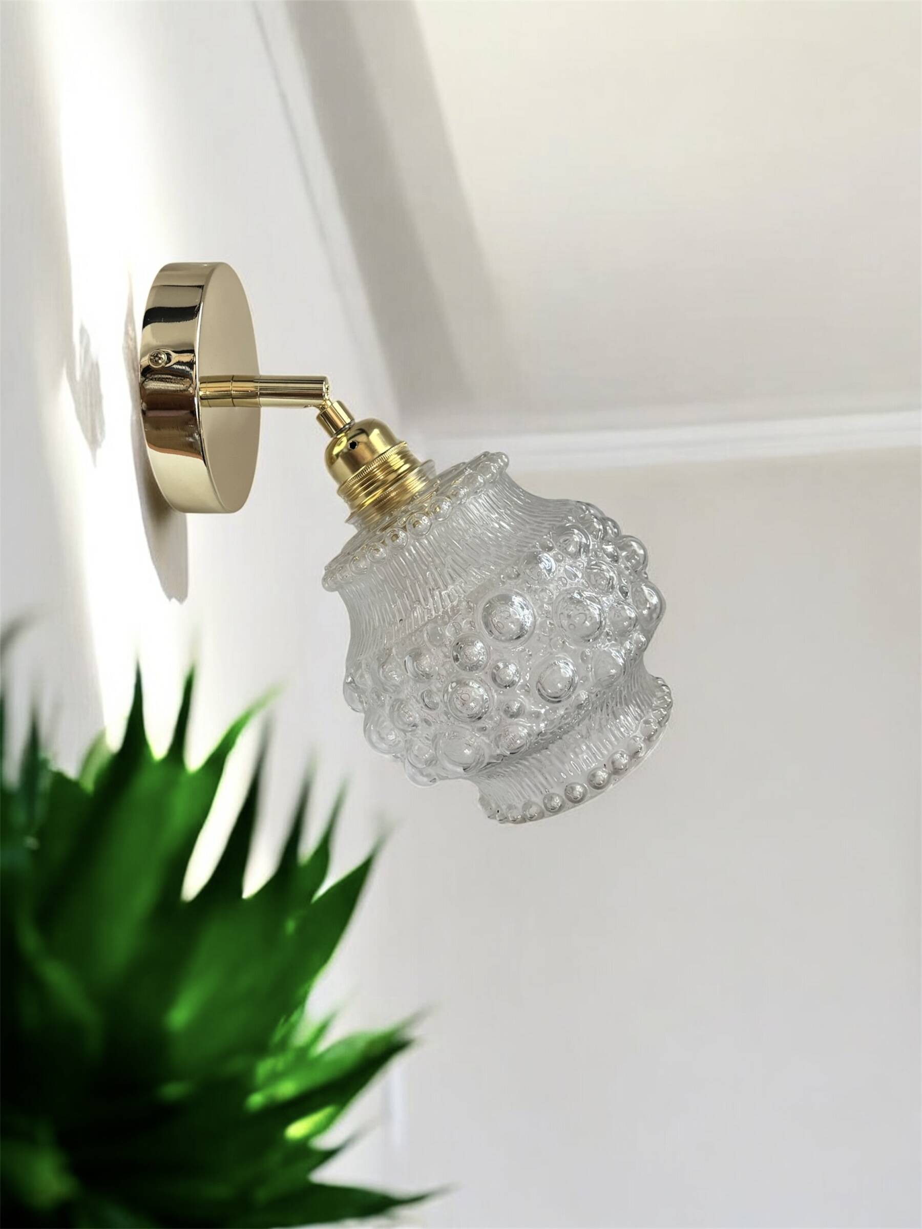 Gold wall light with bubble glass