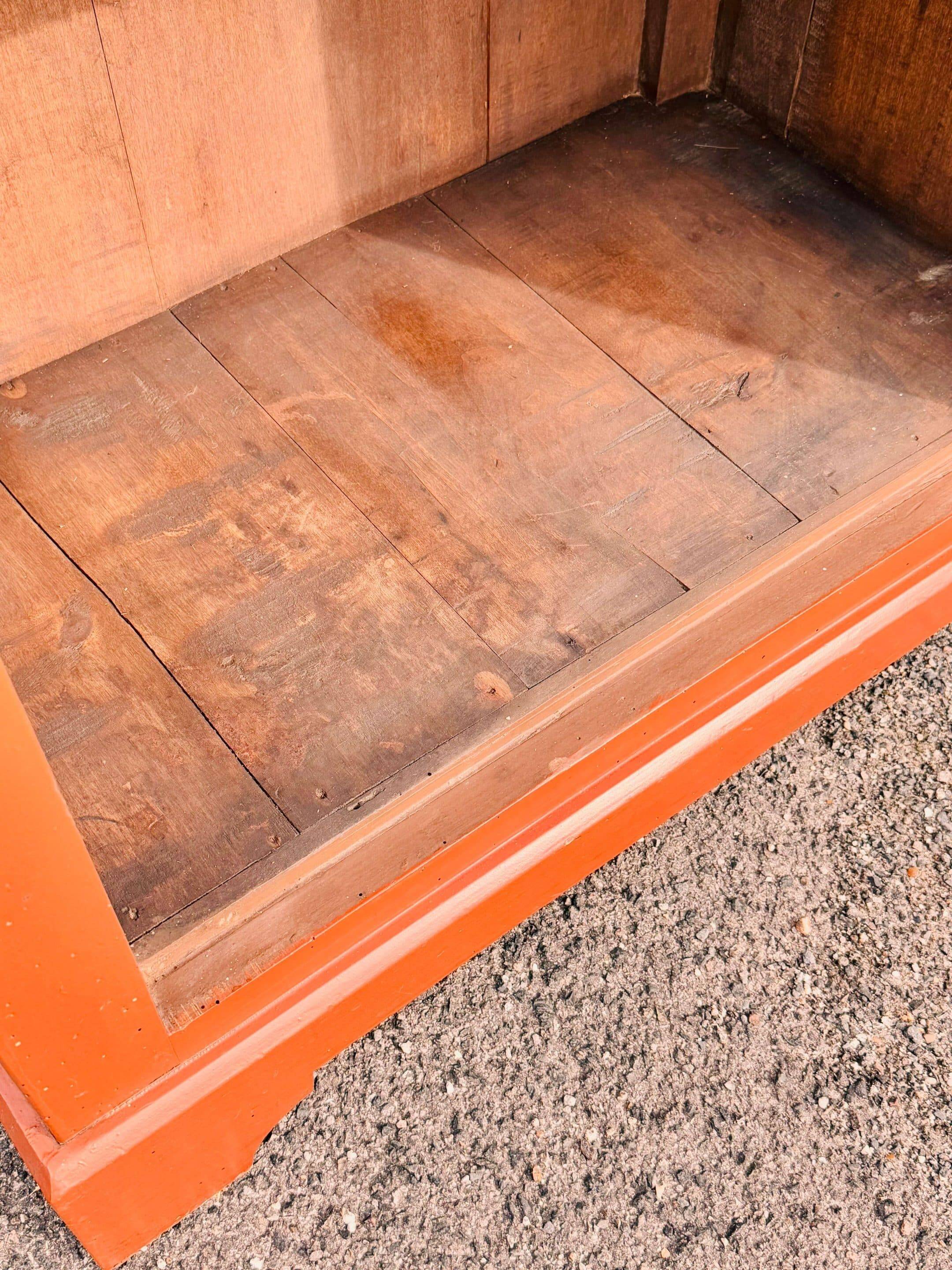 Old terracotta-colored bonnet maker