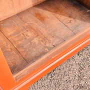Old terracotta-colored bonnet maker