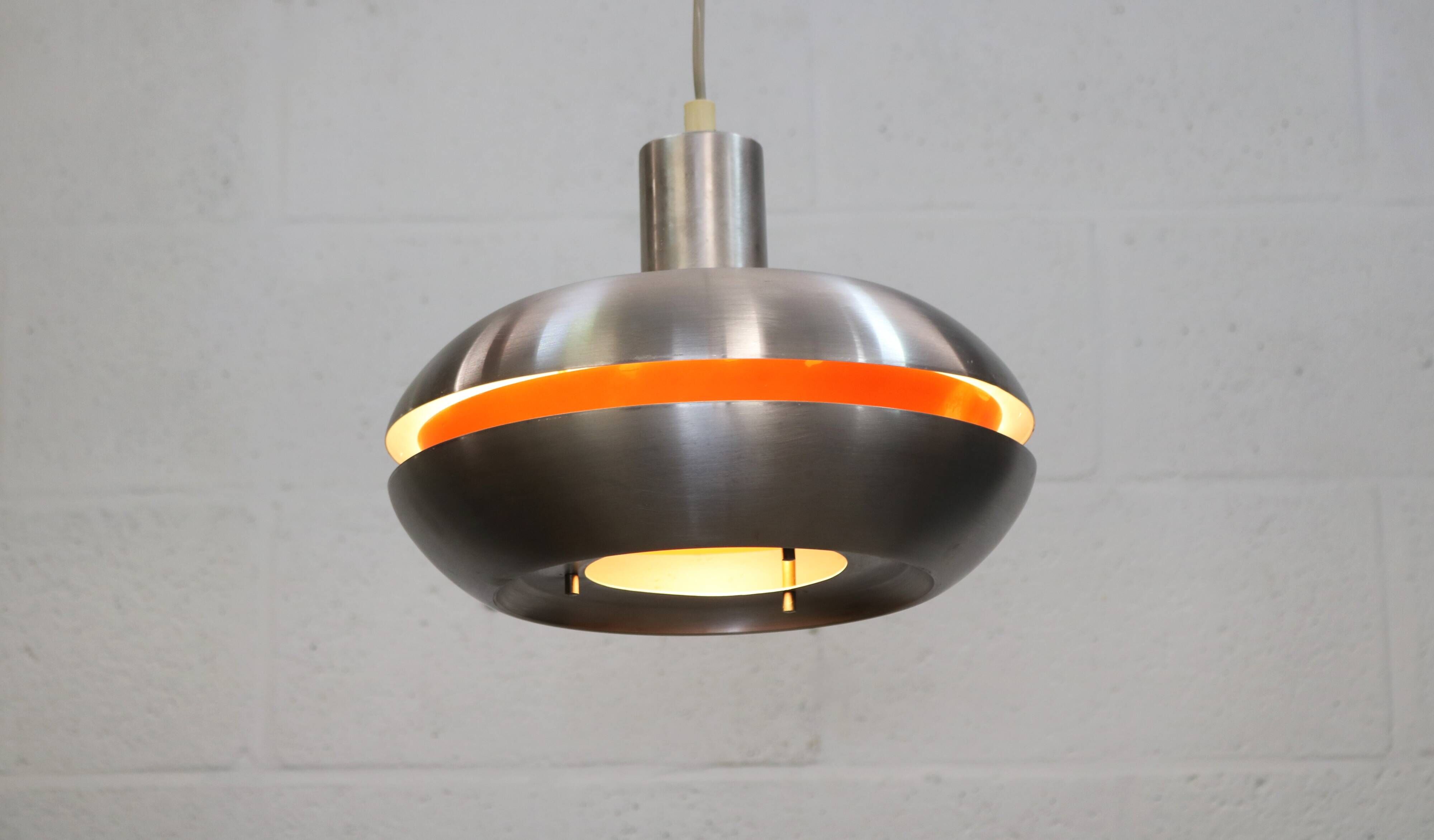 Old Danish space age design lamp in alu and orange inside.