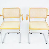 A pair of chairs with armrests, 1970s