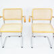 A pair of chairs with armrests, 1970s