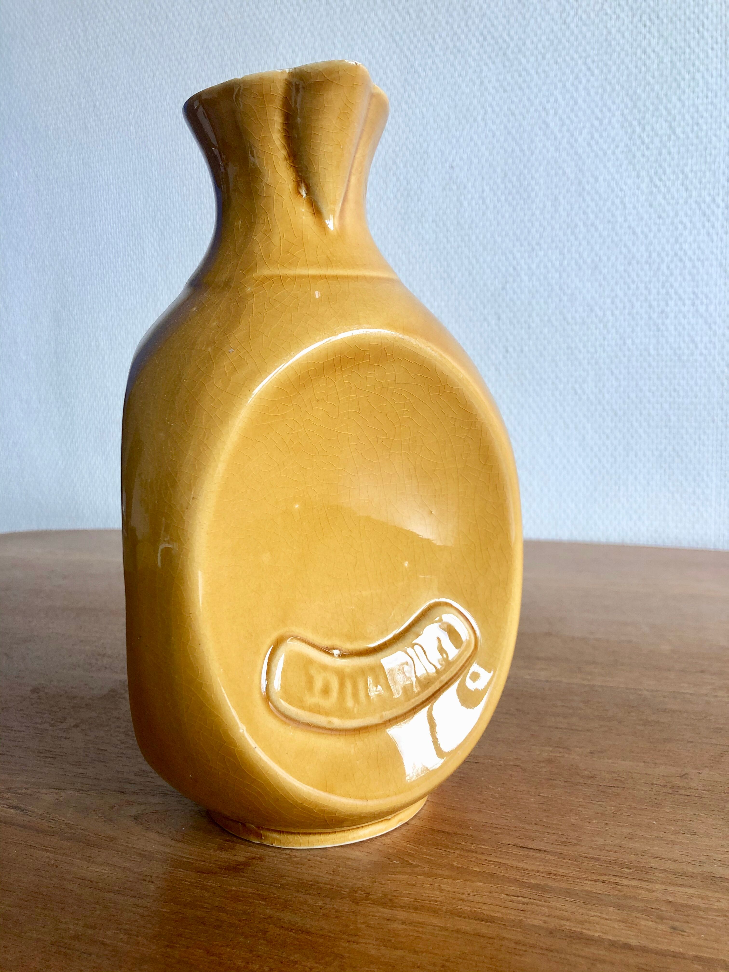 Mustard yellow ceramic pitcher