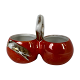 Porcelain salt shaker and orange pepper shaker decorated with a cicada