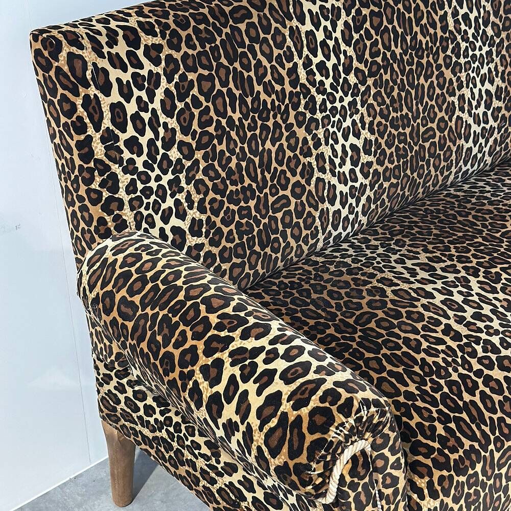 Vintage leopard velvet sofa / wall sofa with drop-down arms, France.