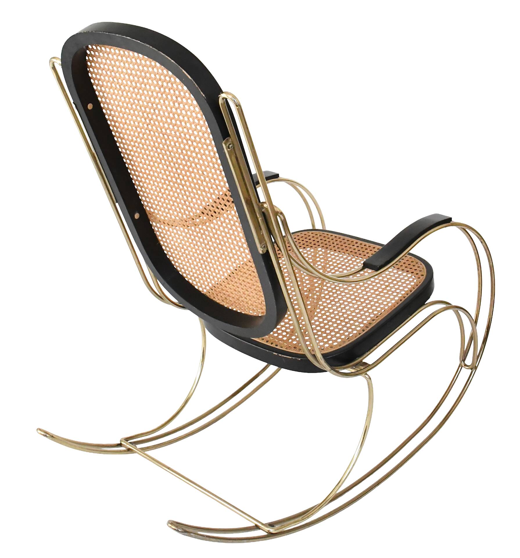 Modernist rocking chair in gilded brass and cane.