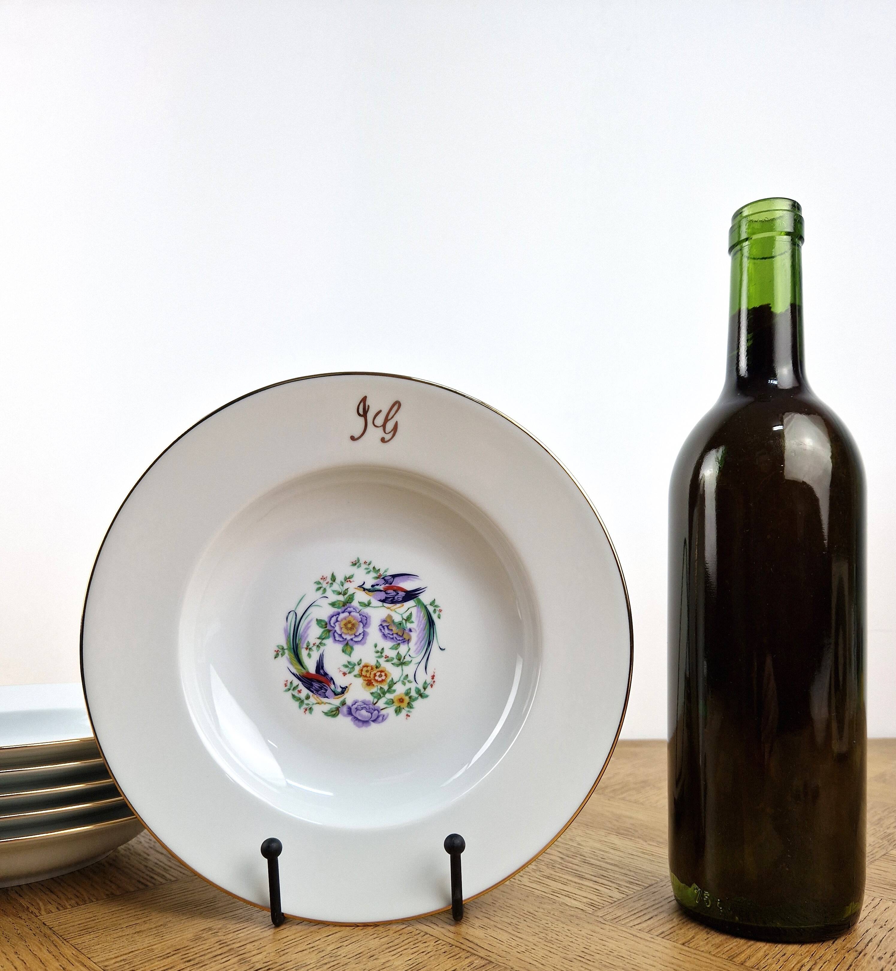 6 deep plates made of Limoges porcelain with a paradise bird design.