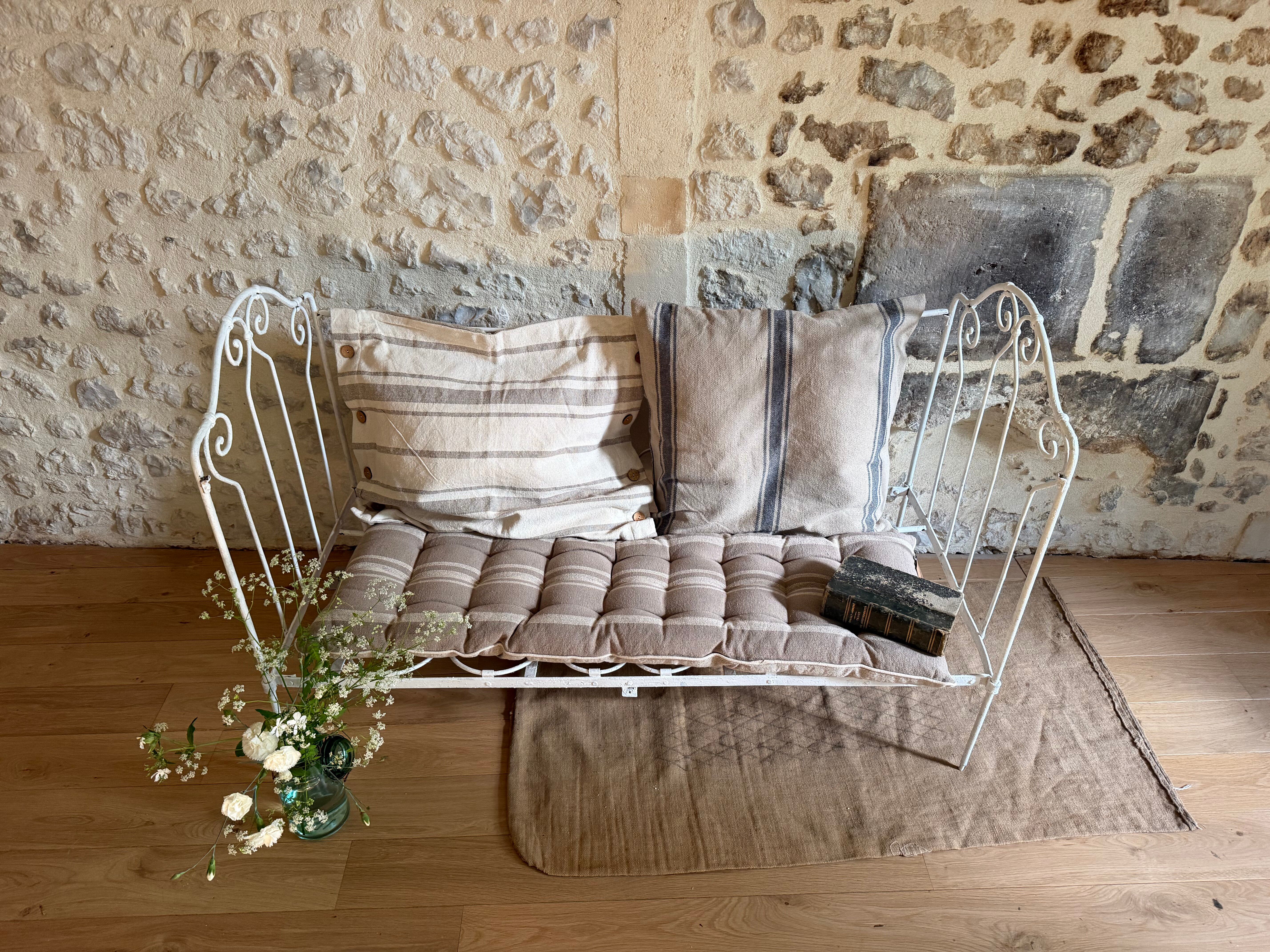 Small renovated wrought iron bed