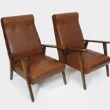 Pair of Scandinavian armchairs in brown leatherette and wood from the 50s and 60s