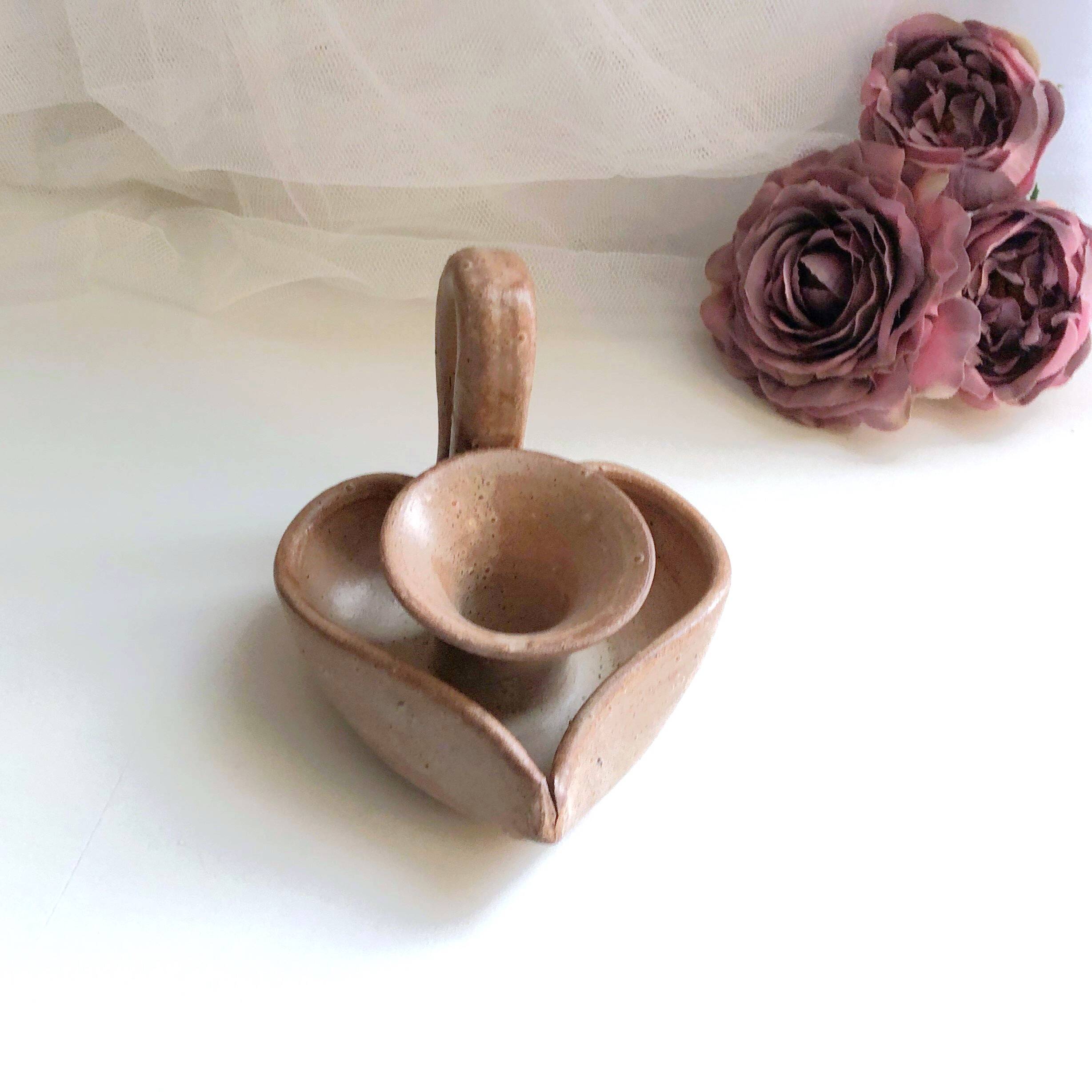 Glazed stoneware heart-shaped hand candle holder