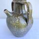 Ancient oil jar in glazed terracotta, khaki green — Auvergne, Lezou
