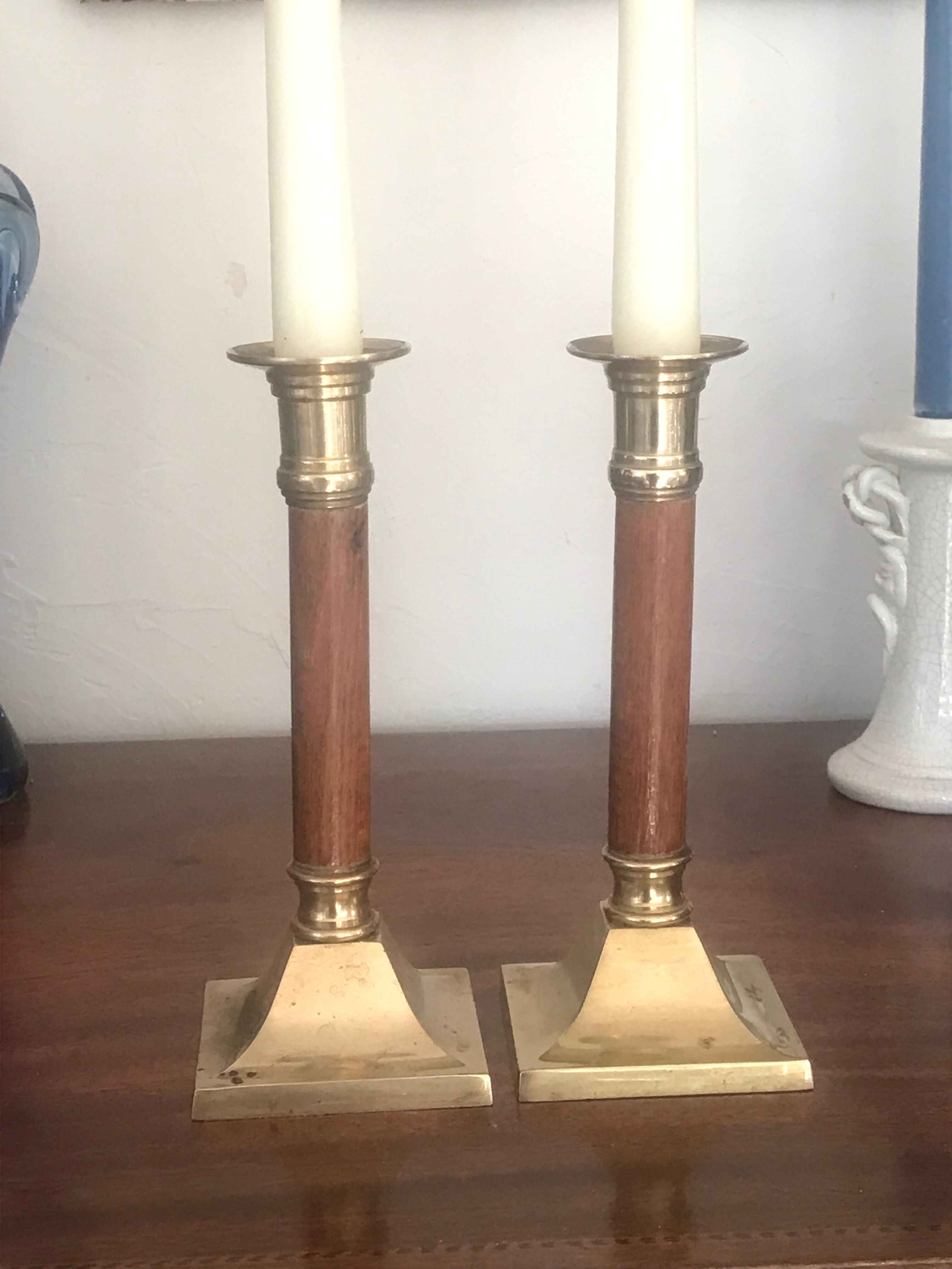 Pair of wood and brass candle holders