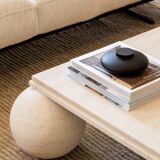 Square stone coffee table with sculptural ball legs