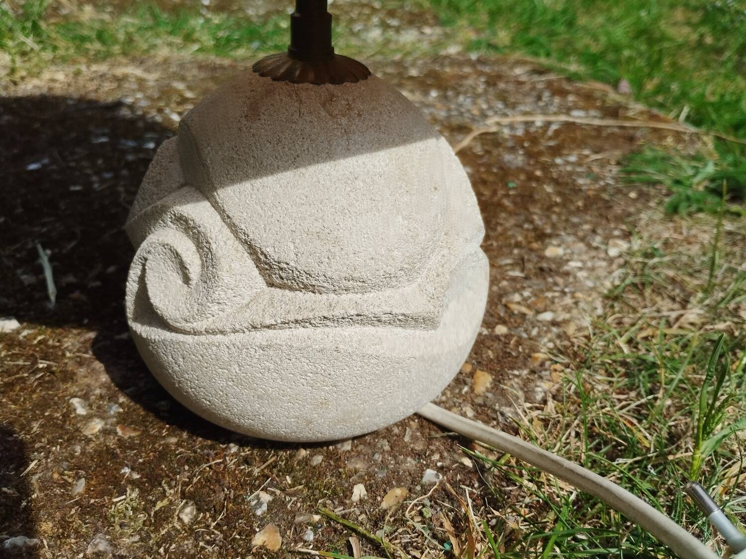 Vintage antique lamp with a stone base.
