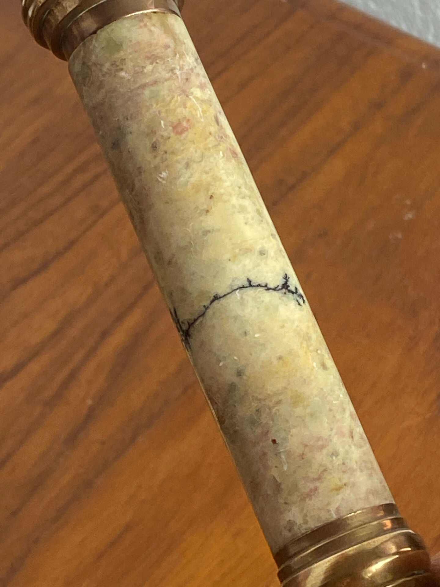 Pair of brass and stone candlesticks