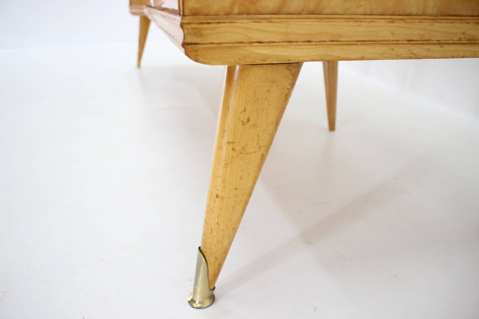 1960s italian sideboard/chest of drawers in high gloss finish with glass top and shelf