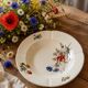 Assiette creuse Terre de Fer HB & Cie décor fleurs des champs 1900-1910
