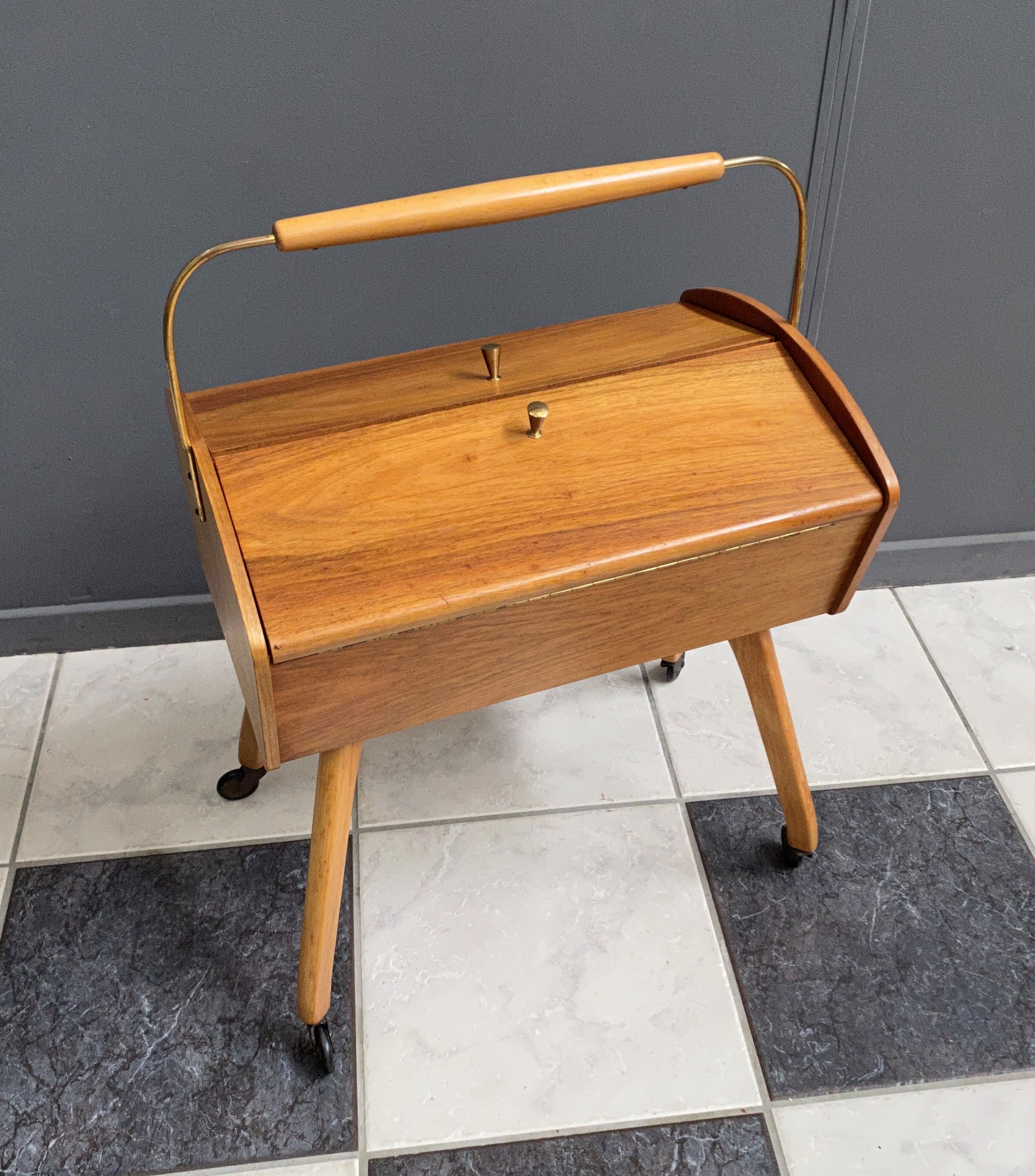 Sewing box on legs and wheels