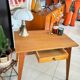 Old wooden desk or side table with compass legs