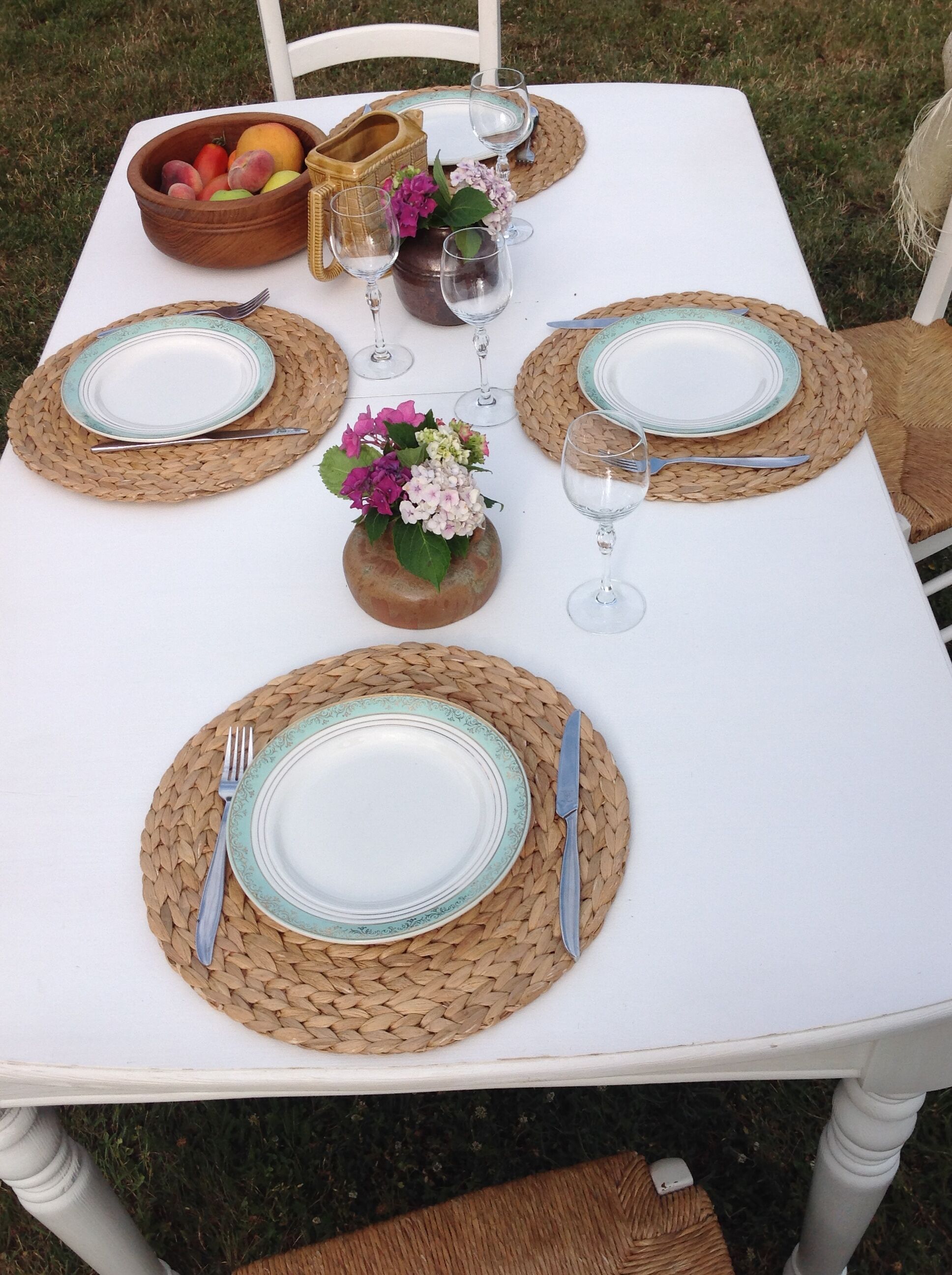 White farmhouse table set and four chairs