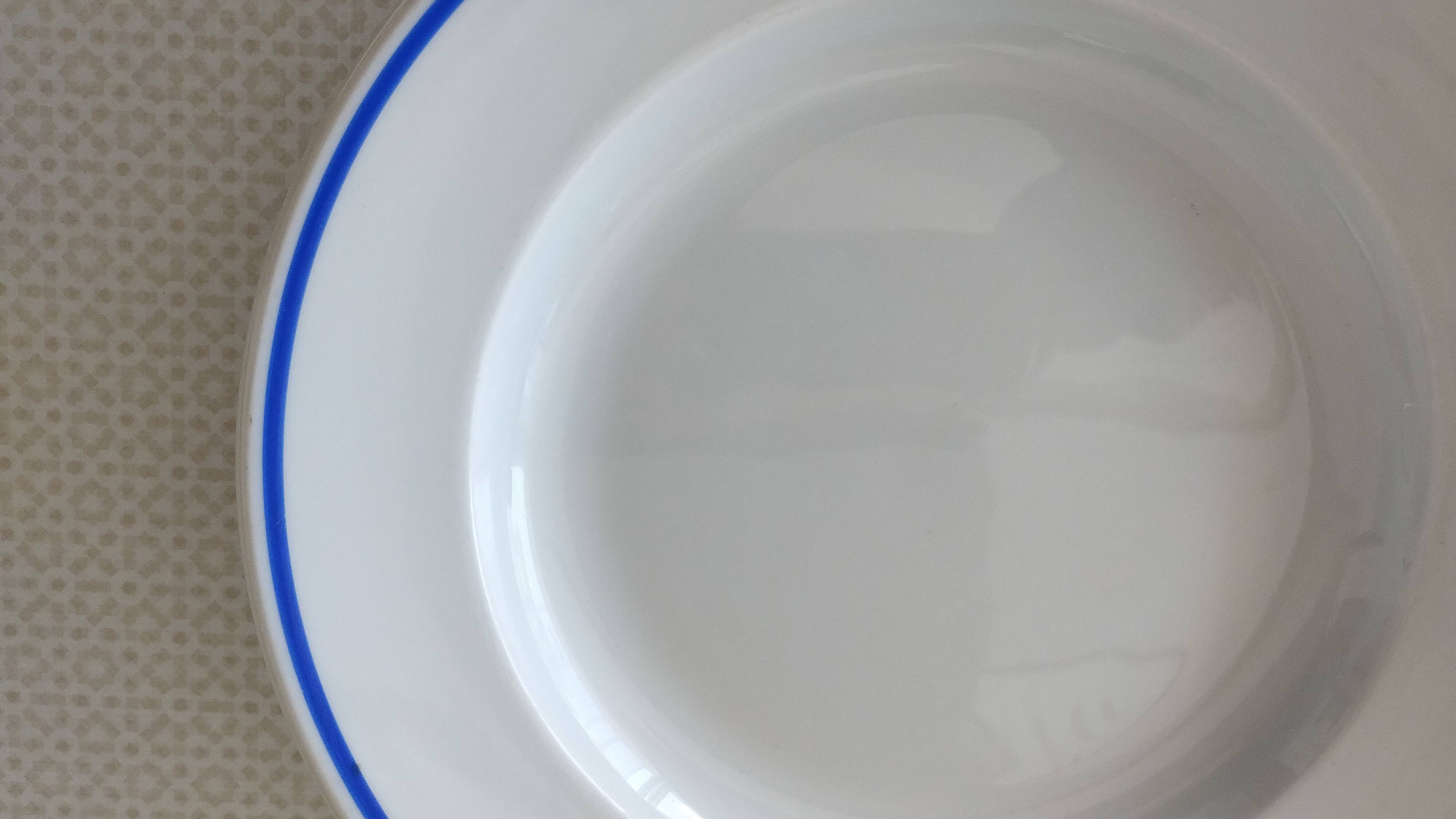 3 Pillivuyt white porcelain dinner plates with blue edging.