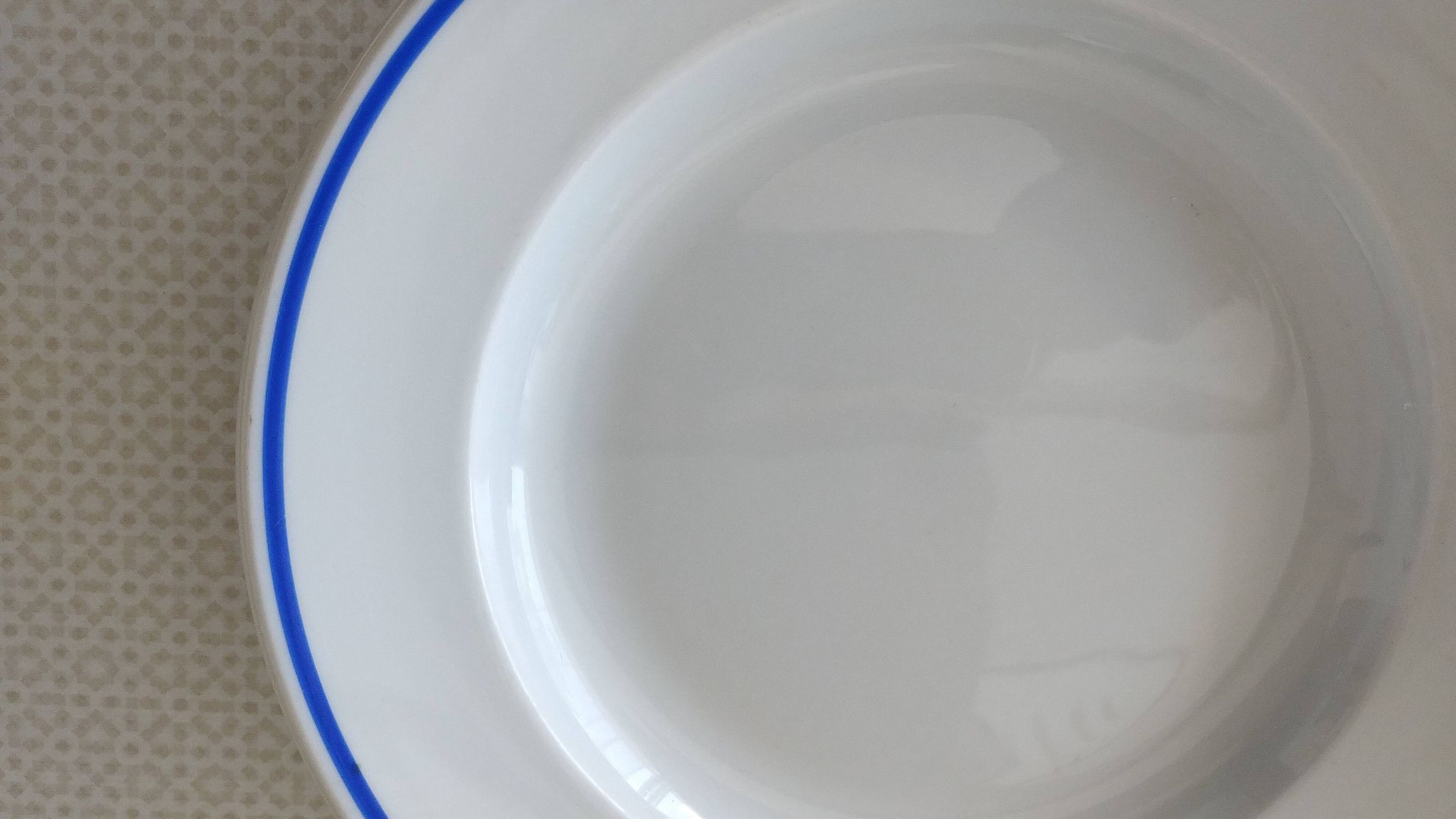3 Pillivuyt white porcelain dinner plates with blue edging.