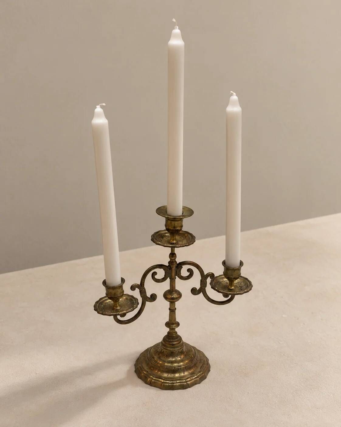 Three-light candelabrum in engraved brass — France, circa 1900