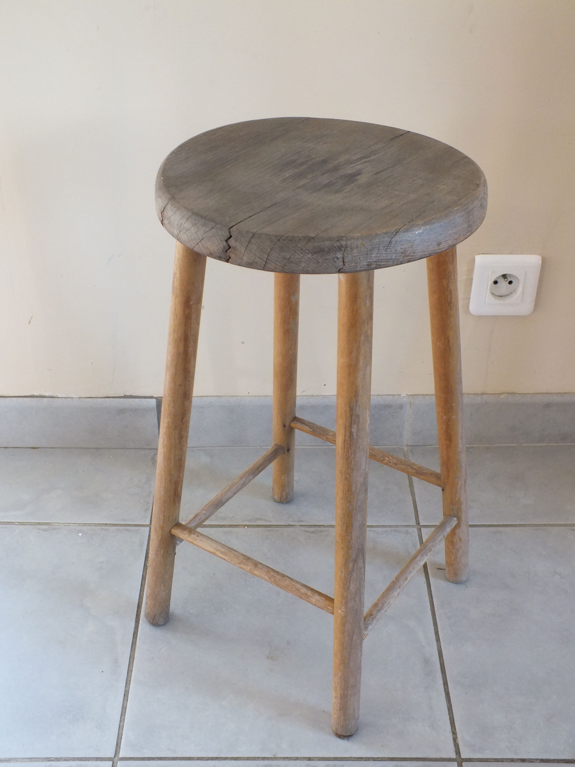 Vintage stool in patinated natural wood