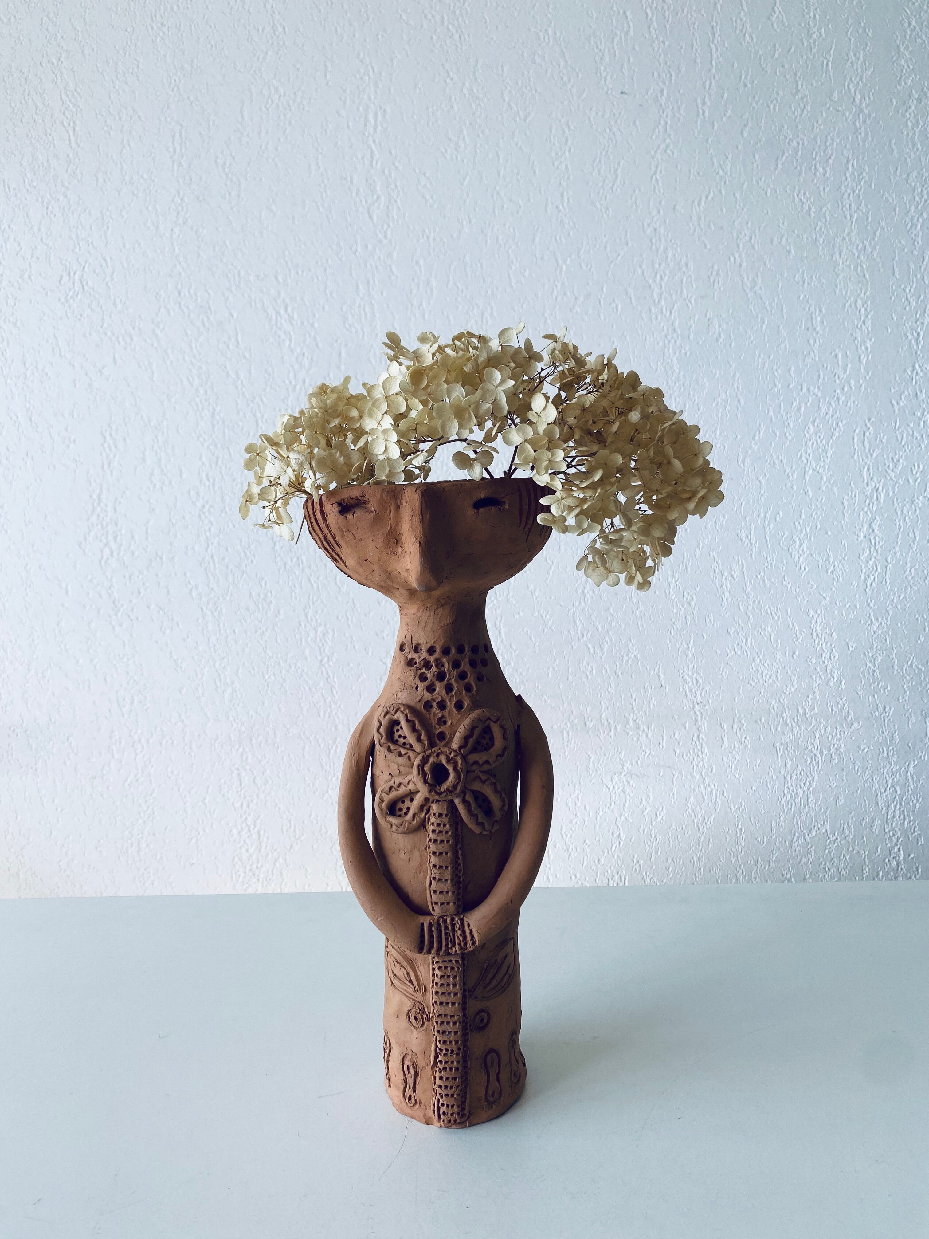 Terracotta personified vase