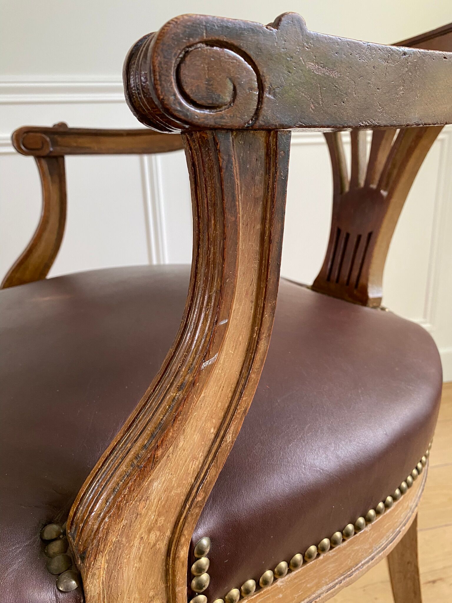 Vintage office chair in wood and brown studded leather late nineteenth