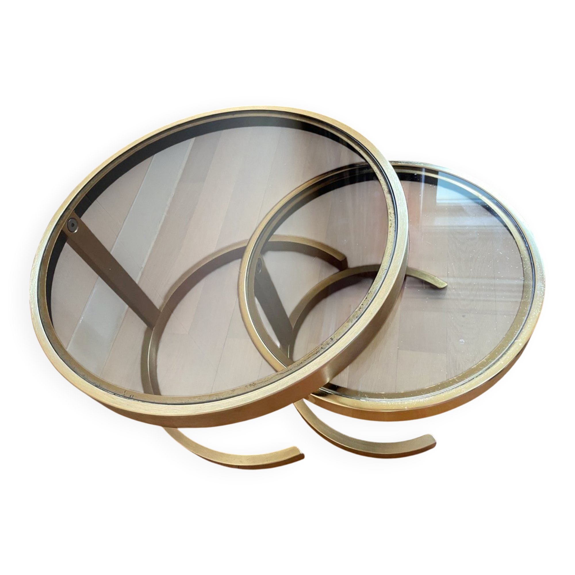 Nest of coffee tables in glass and brass.
