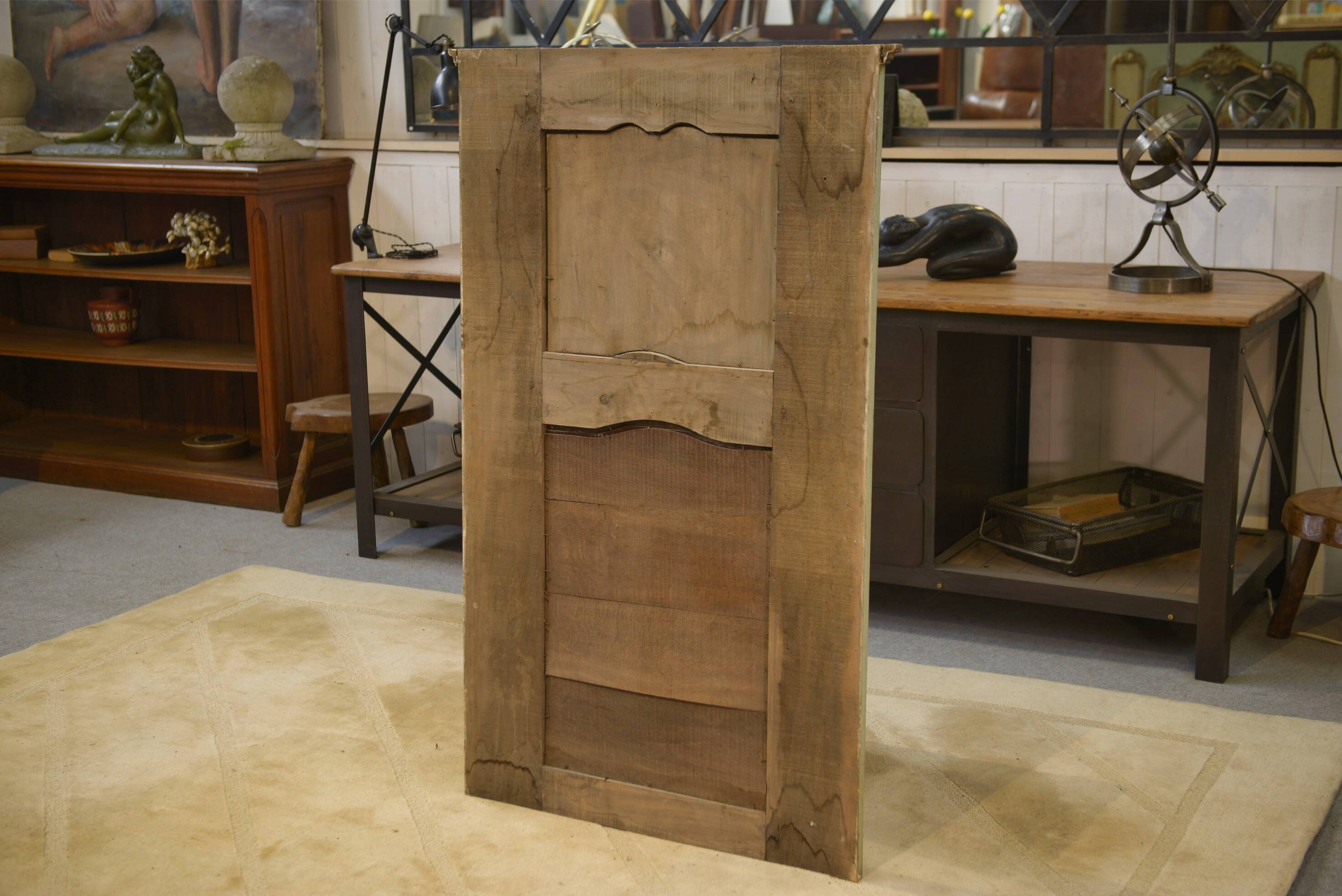 Trumeau mirror with cracked patina and oil on panel depicting a romantic scene from the 19th century.