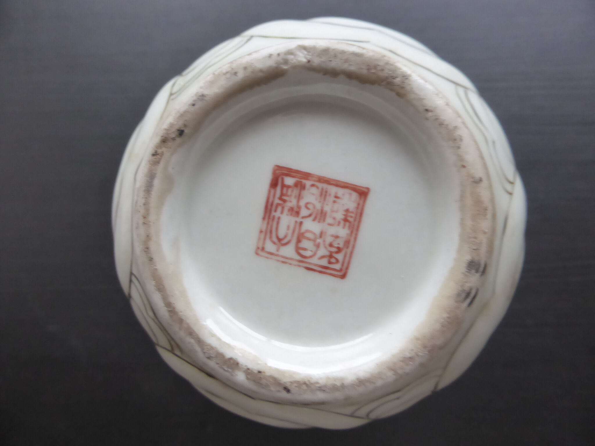Ancient Asian ceramic vase green and white background decorated with butterflies