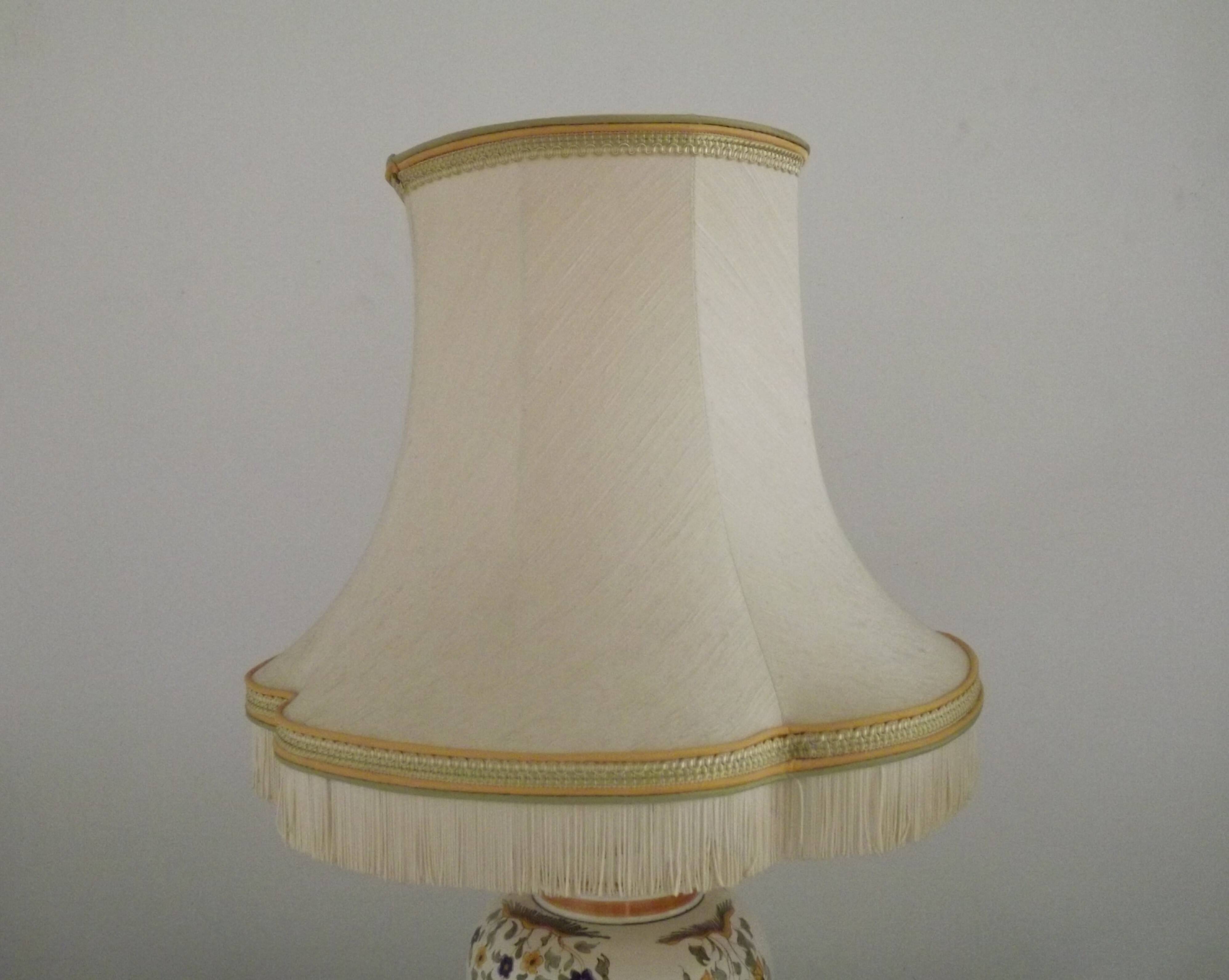 Table lamp with wooden base and fringed shade