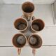 Set of 5 vintage handcrafted stoneware mugs in beige, pink, and white glazed stoneware