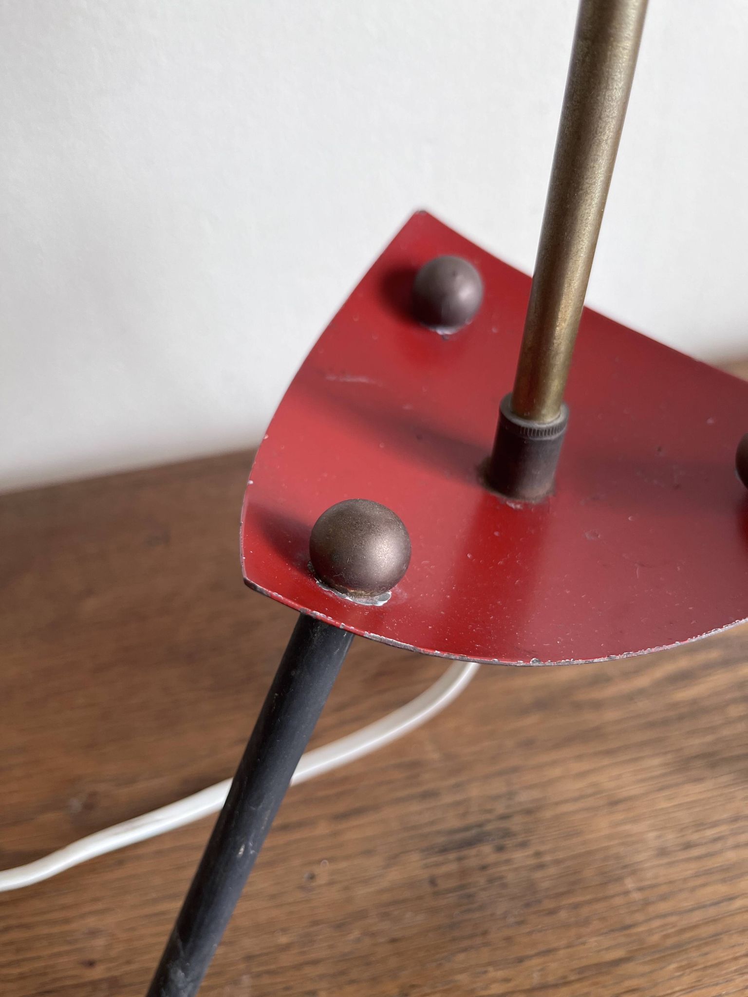 1950s modernist tripod lamp made of sheet metal and brass.