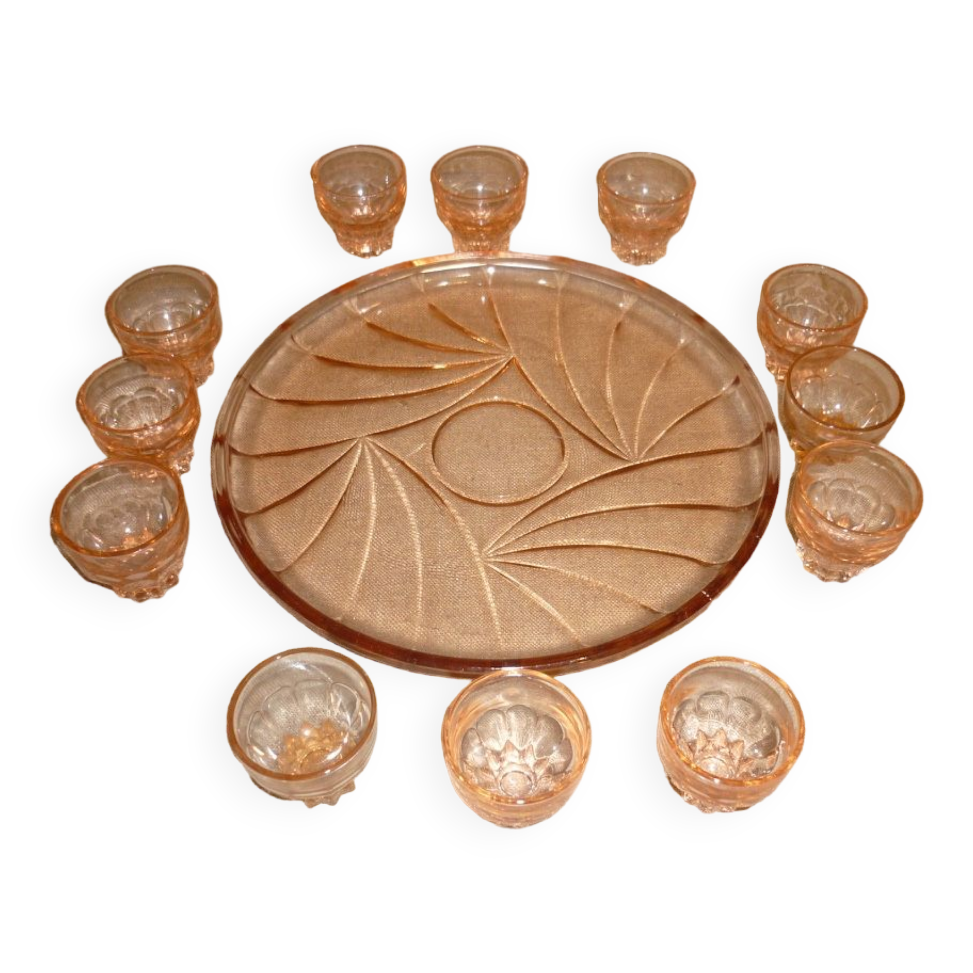 12 shot glasses on pink glass tray