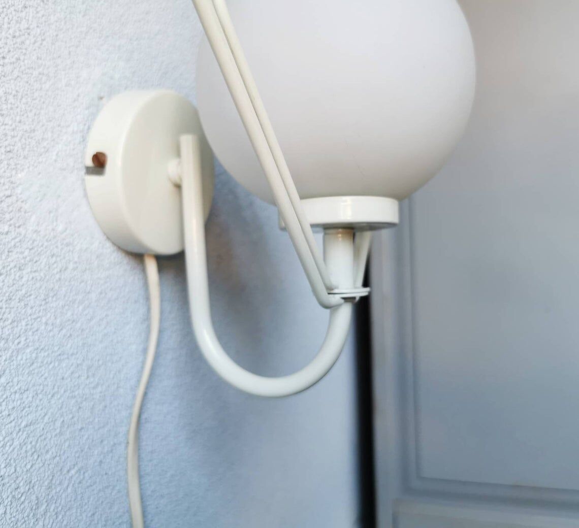 Metal applique with 80s glass sphere