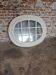 Oval mirror in window style with wooden crossbars – chic country decor