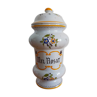 Vintage antique pharmacy jar in earthenware floral patterns
