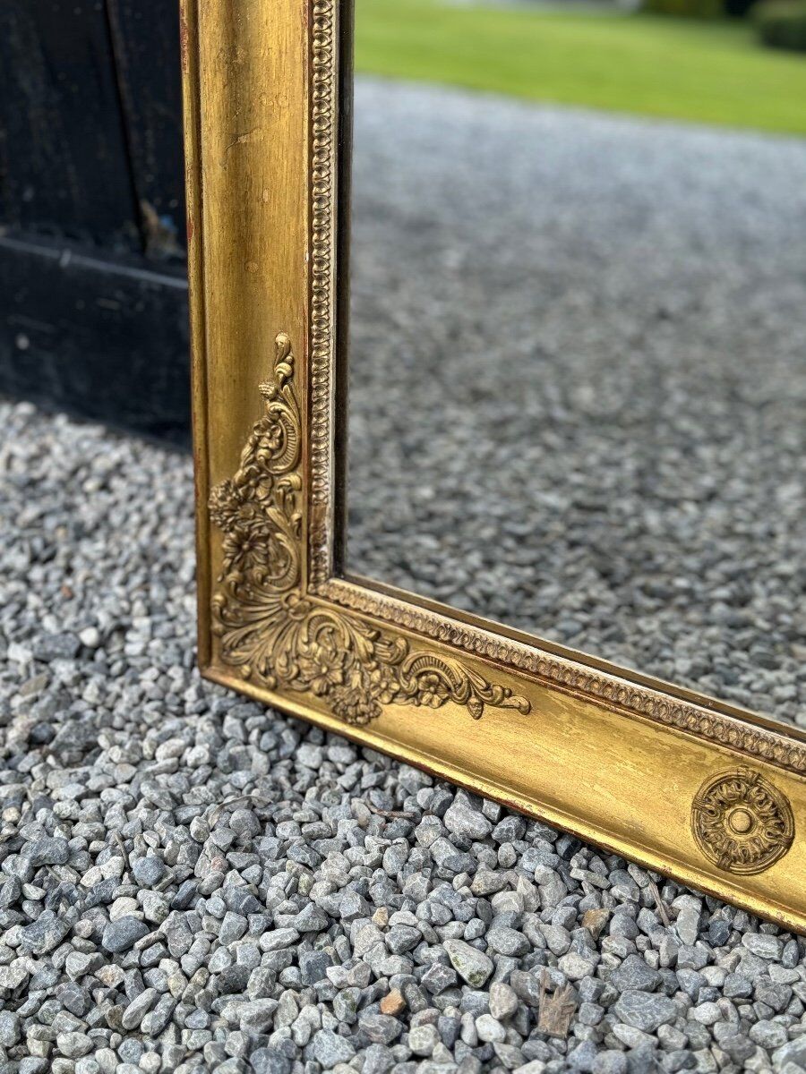 Miroir Empire en bois stuqué et doré, début XIXème siècle