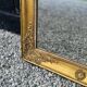 Miroir Empire en bois stuqué et doré, début XIXème siècle