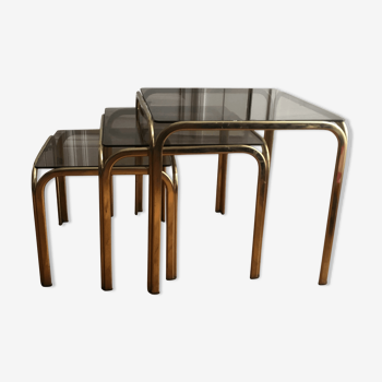 Set of three nesting tables in brass and smoked glass